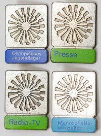 4 offizielle Teilnehmerabzeichen Olympische Spiele 1972. Bronze, versilbert, farbige Schriftleiste. Je 3,5x2,5 cm.