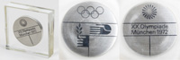 Teilnehmermedaille fr die Olympischen Spiele Mnchen 1972. Edelstahl 4,9 cm Durchmesser. 1,1 cm Dicke. In original Acryl-Prsentationsbox. Medaille fr Athleten und Offizielle.